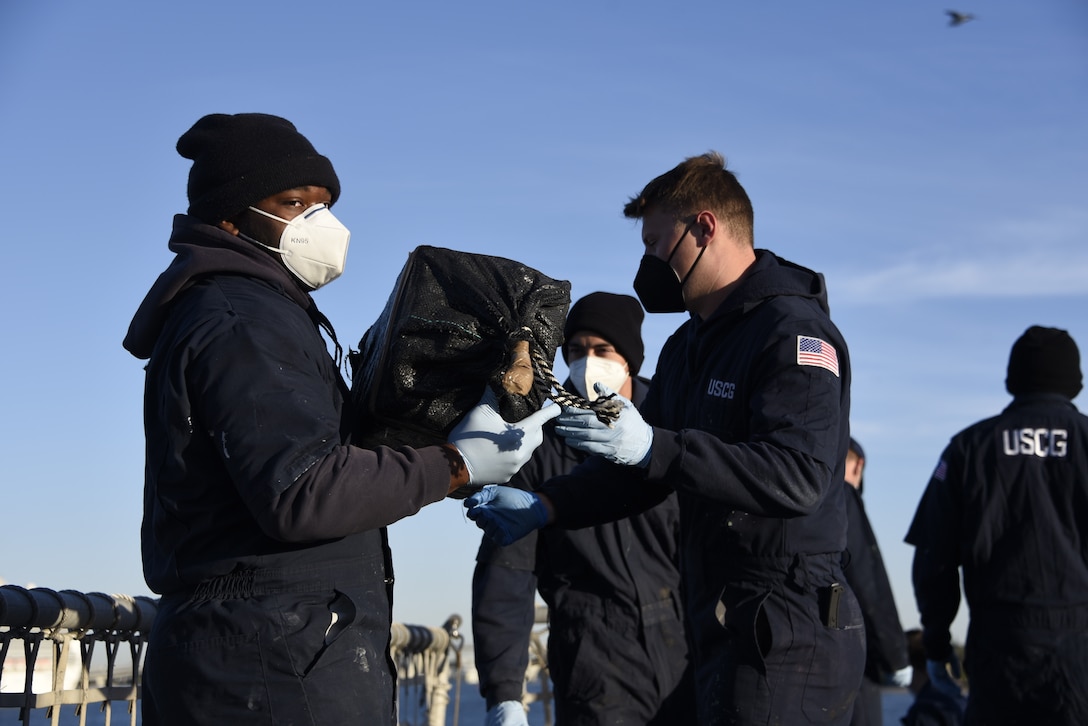The Coast Guard Cutter Campbell (WMEC 909) crew offloads approximately 7,250 pounds of cocaine at Port Everglades, Florida, Feb. 4, 2021.