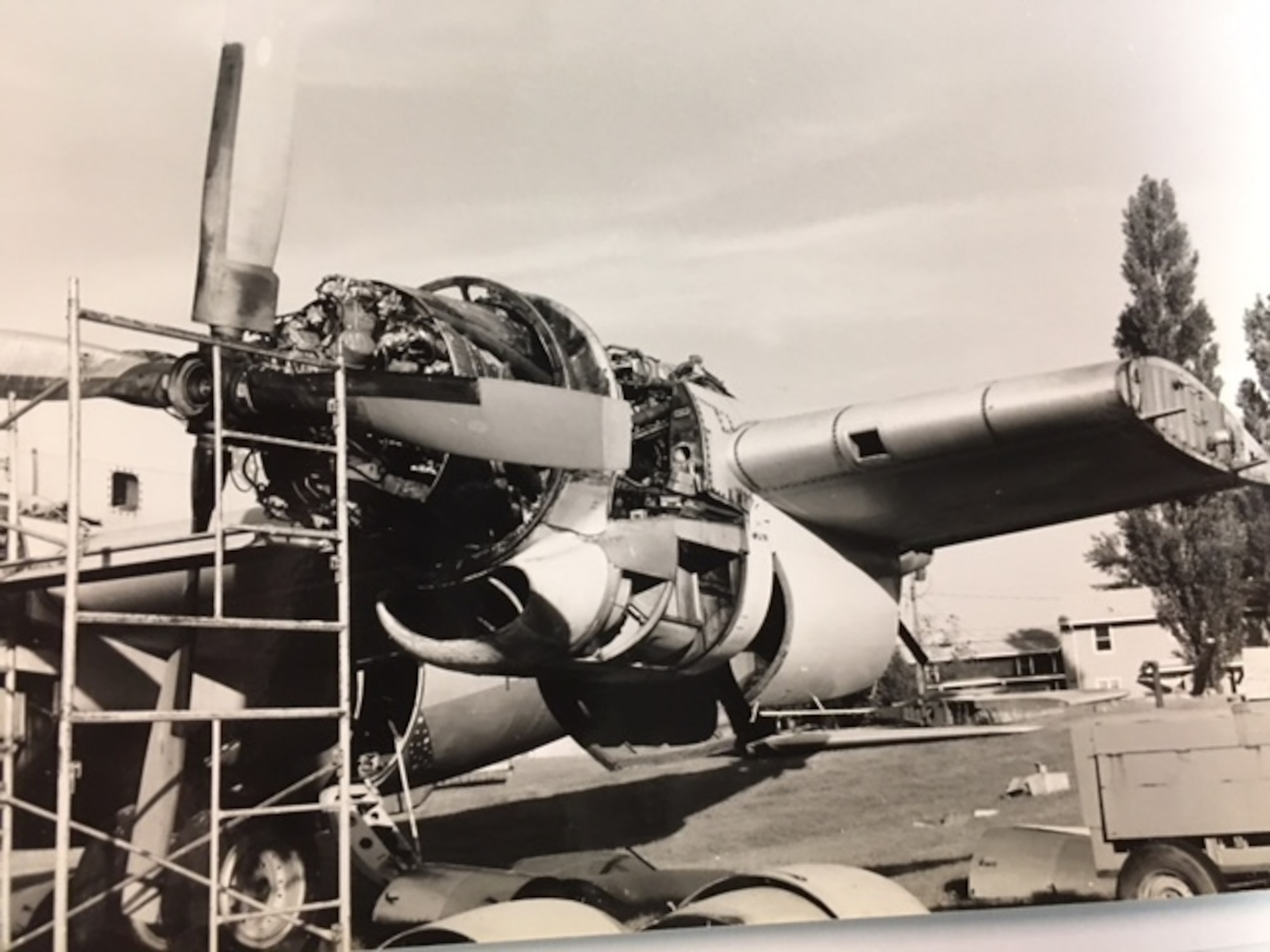 One of the engines of a B-29 Superfortress sits partially disassembled in the wing of the aircraft.