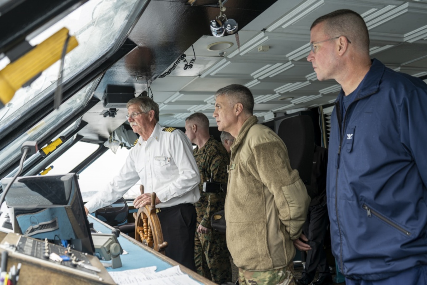 U.S. Army Gen. Paul Nakasone (middle) and Coast Guard Capt. Kevin Carroll (right) get a tour of the bridge aboard the Spirit of Norfolk while transiting to Coast Guard Base Portsmouth, Virginia, March 6, 2020. The two servicemembers were participating in the Cyber Component Commanders’ Conference, which served to raise awareness of the importance of maintaining strong cyber security postures within the Coast Guard. (U.S. Coast Guard photo by Seaman Katlin Kilroy)