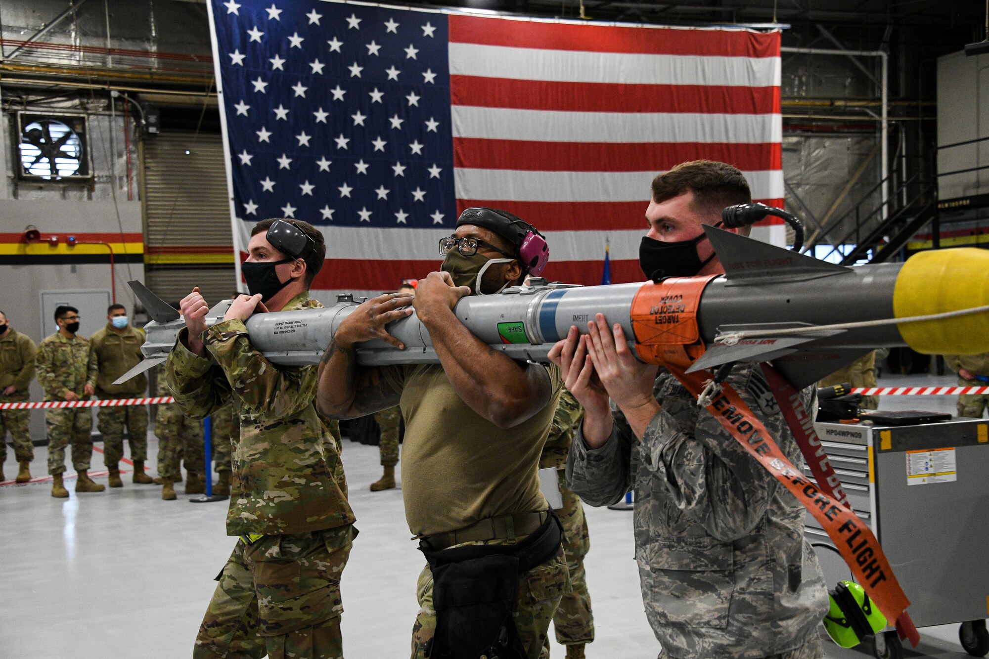 A photo of F-35 maintainers loading weapons