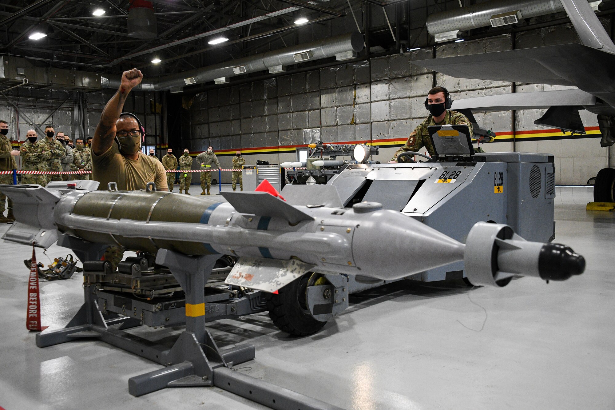 A photo of F-35 maintainers loading weapons