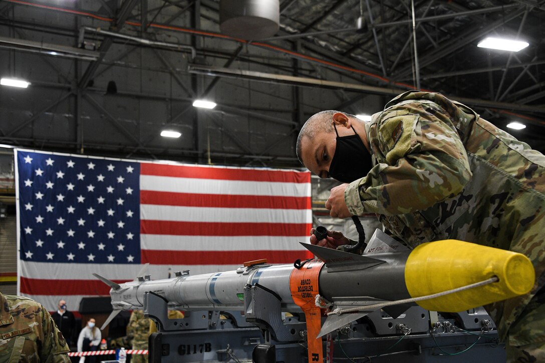 A photo of F-35 maintainers loading weapons