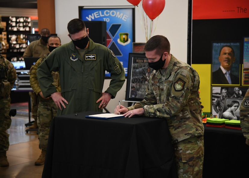 Minot Air Force Base leadership signs a Black History Month proclamation.