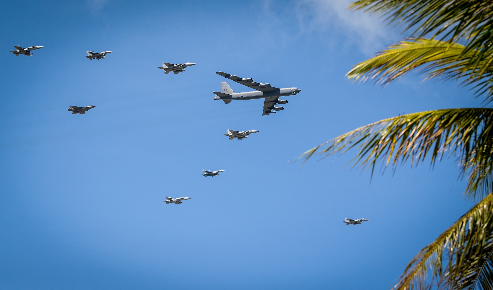 Aircraft fly in formation during Cope North 21