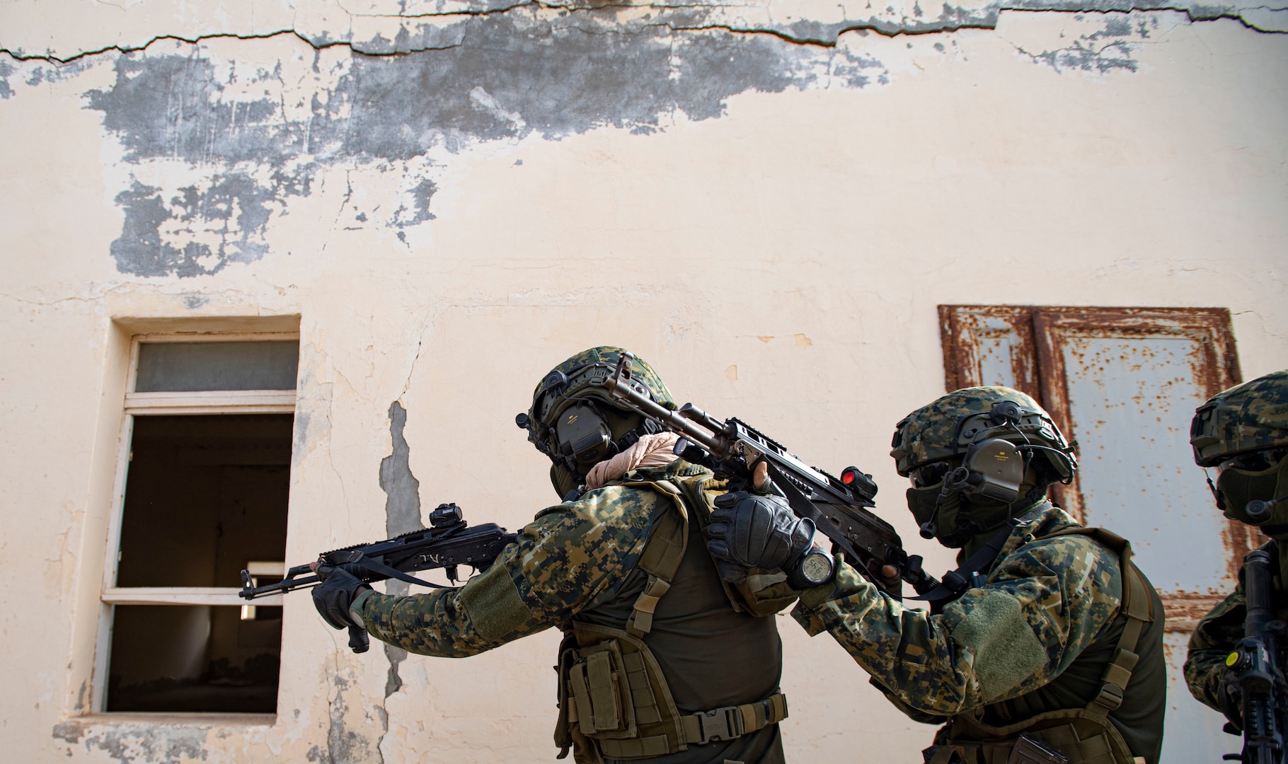 Guinean special forces soldiers conduct close quarters battle training in abandoned hotel