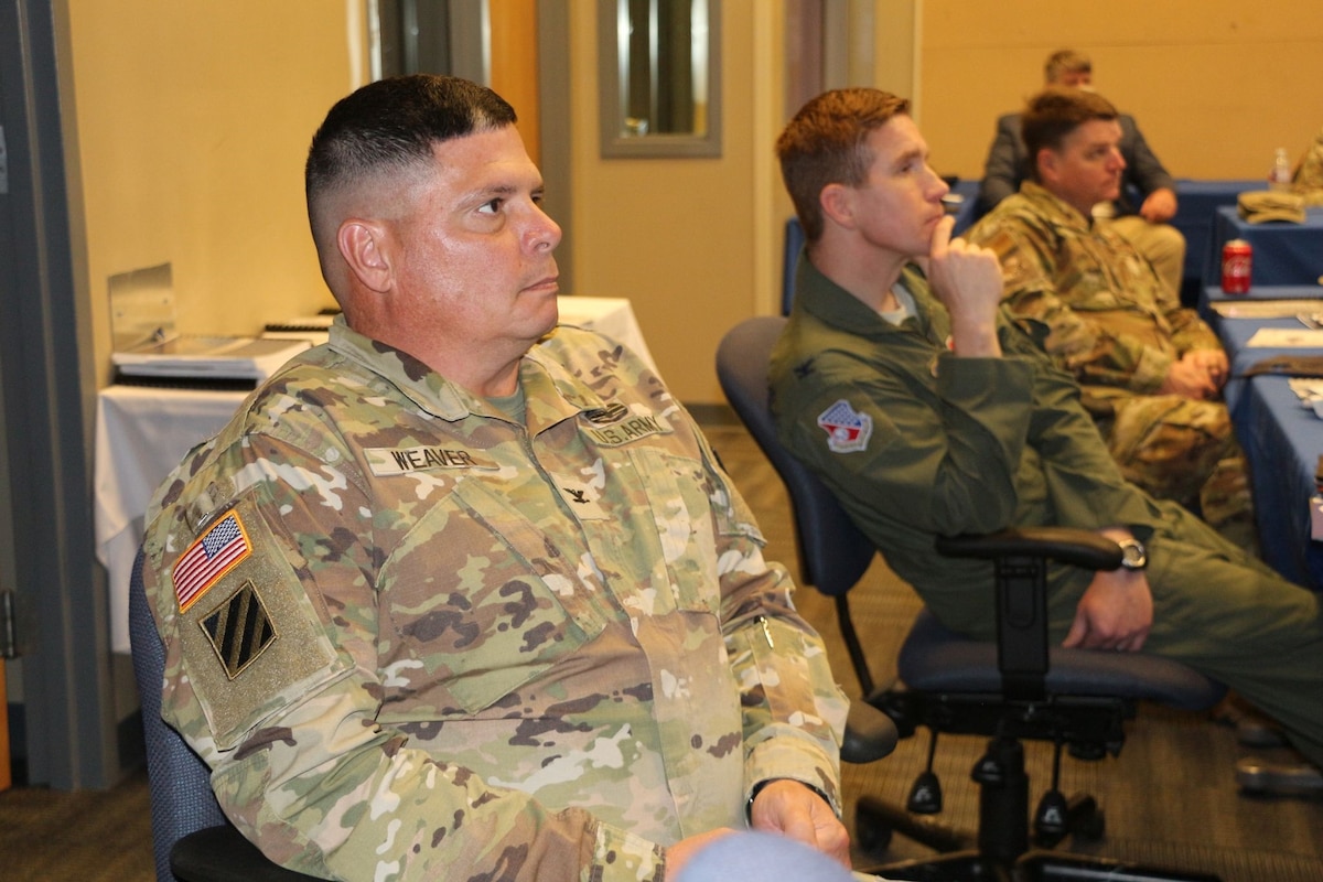 U.S. Army Col. Rick Weaver, Camp Shelby Joint Forces Training Center commander, listens to a speaker during a meeting of the Installation Commanders Counsel at the Combat Readiness Training Center in Gulfport, Miss., Nov. 17, 2020. Seated to Weaver’s left are Col. Britt Watson, 186th Refueling Air Wing vice commander, and Col. Tommy Tillman, 172d Airlift Wing Commander.