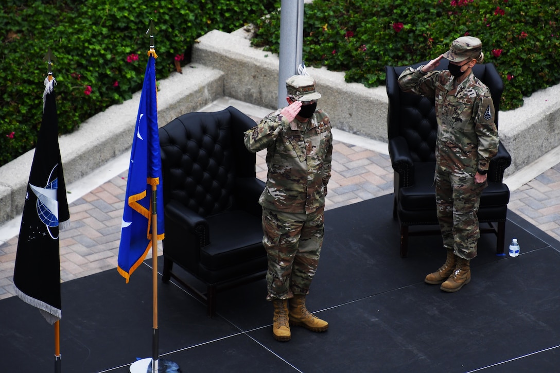 U.S. Air Force Lt. Gen. John F. Thompson, Space and Missile Systems Center commander, left, and Chief Master Sgt. Lisa R. Arnold, SMC command chief, salute during a U.S. Space Force transfer ceremony at Los Angeles Air Force Base, Calif., Feb. 9, 2021. Thompson was the key note speaker and presided over the Oath of Office and Oath of Enlistement which transfered a total of 113 personnel; 74 in person and 39 virtual. More than 2,400 members in space-related career fields around the globe will transition from the U.S. Air Force into the U.S. Space Force over the next several months. (U.S. Space Force photo by Staff Sgt. Luke Kitterman)