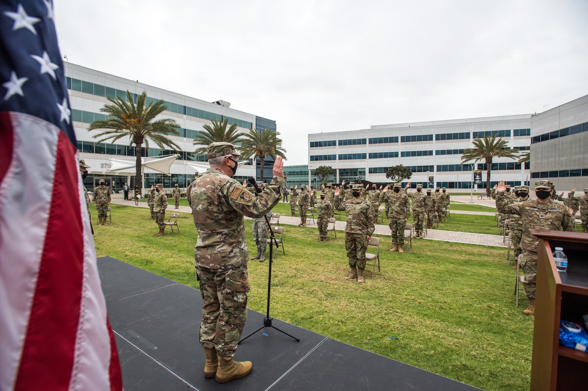 U.S. Air Force Lt. Gen. John F. Thompson, Space and Missile Systems Center commander, facilitates the Oath of Office to soon-to-be Guardians during a U.S. Space Force transfer ceremony at Los Angeles Air Force Base, Calif., Feb. 9, 2021. SMC transferred a total number of 113 military members into the U.S. Space Force which was split into two ceremonies throughout the day. (U.S. Space Force photo by Van Ha)