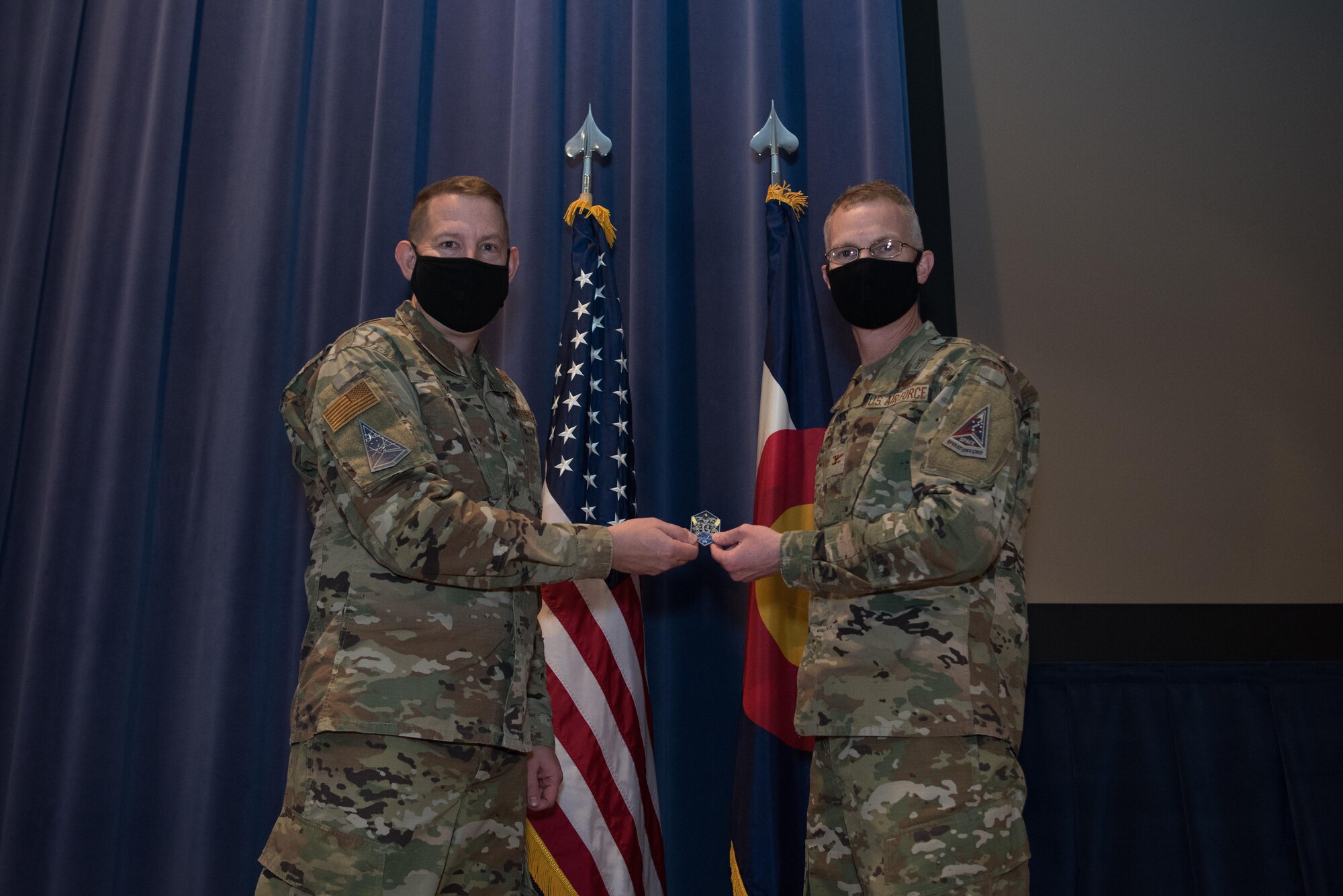 Man presenting coin to another man