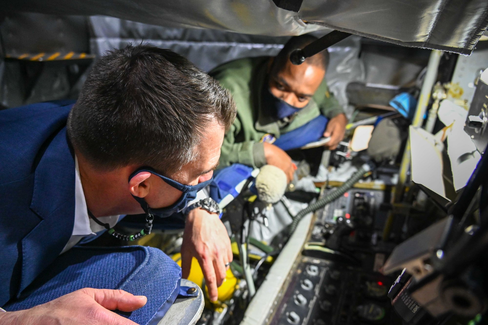 Master Sgt. Bobby Jackson, 465th Air Refueling Squadron boom operator, shows The Honorable J. Kevin Stitt, Governor of Oklahoma, the inside of the boom pod aboard a KC-125R Stratotanker during a visit to the 507th Air Refueling Wing, Feb. 5, 2021, at Tinker Air Force Base, Oklahoma. (U.S. Air Force photo by Senior Airman Mary Begy)