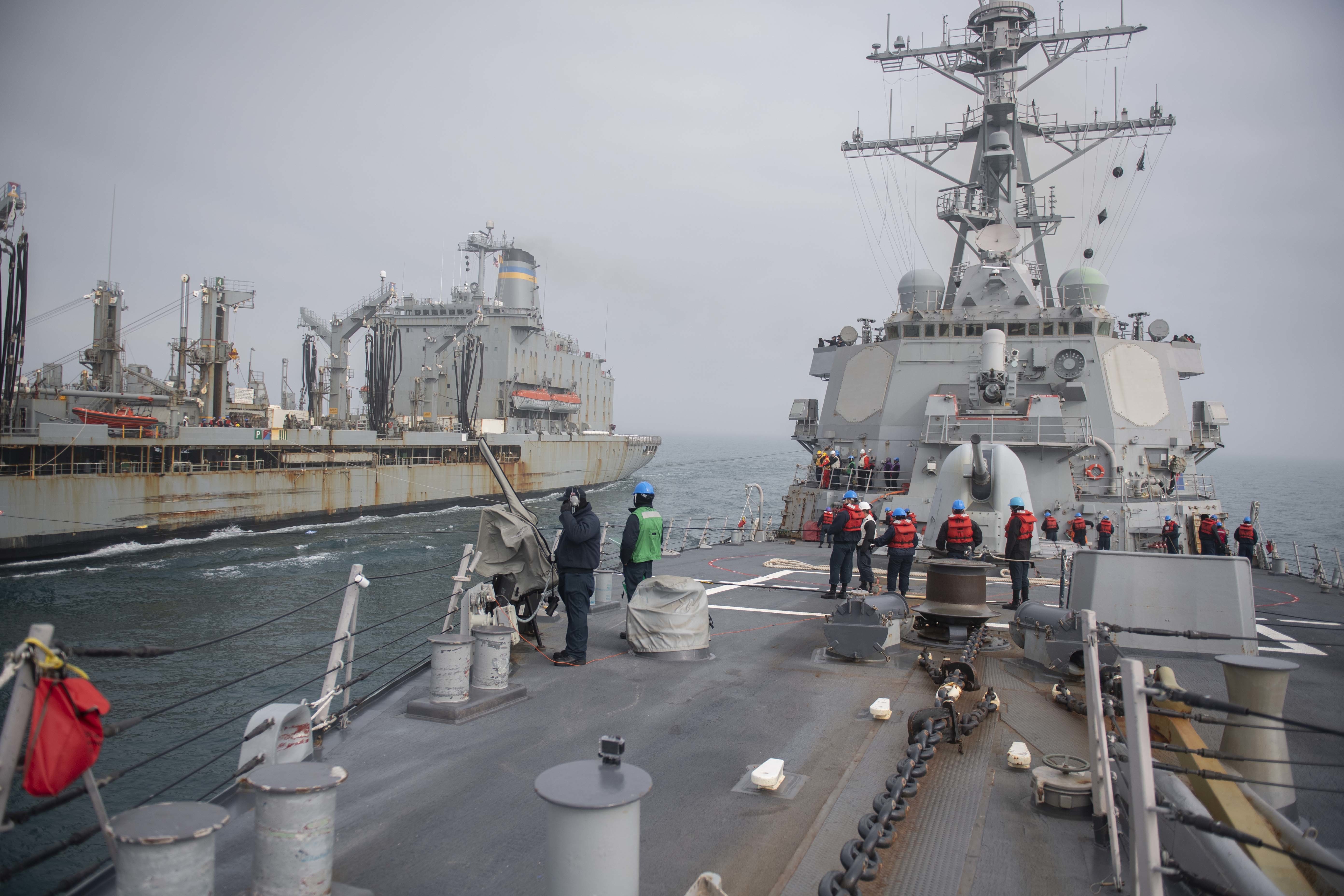 Sailors aboard the Arleigh Burke-class guided-missile destroyer USS Donald Cook (DDG 75) participate in an underway replenishment with the Henry J. Kaiser-class fleet replenishment oiler USNS Laramie (T-AO 203) in the Black Sea.