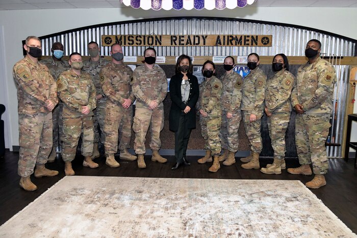 Photo shows a group of people lined up for a photo.