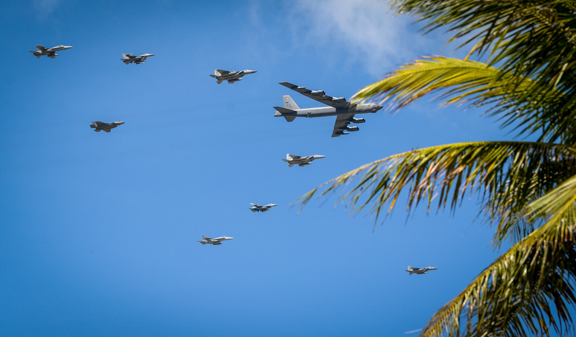 U.S. Air Force, Japan Air Self-Defense and Royal Australian Air Force aircraft fly in formation during Cope North 21 at Andersen Air Force Base, Guam, Feb. 9, 2021.