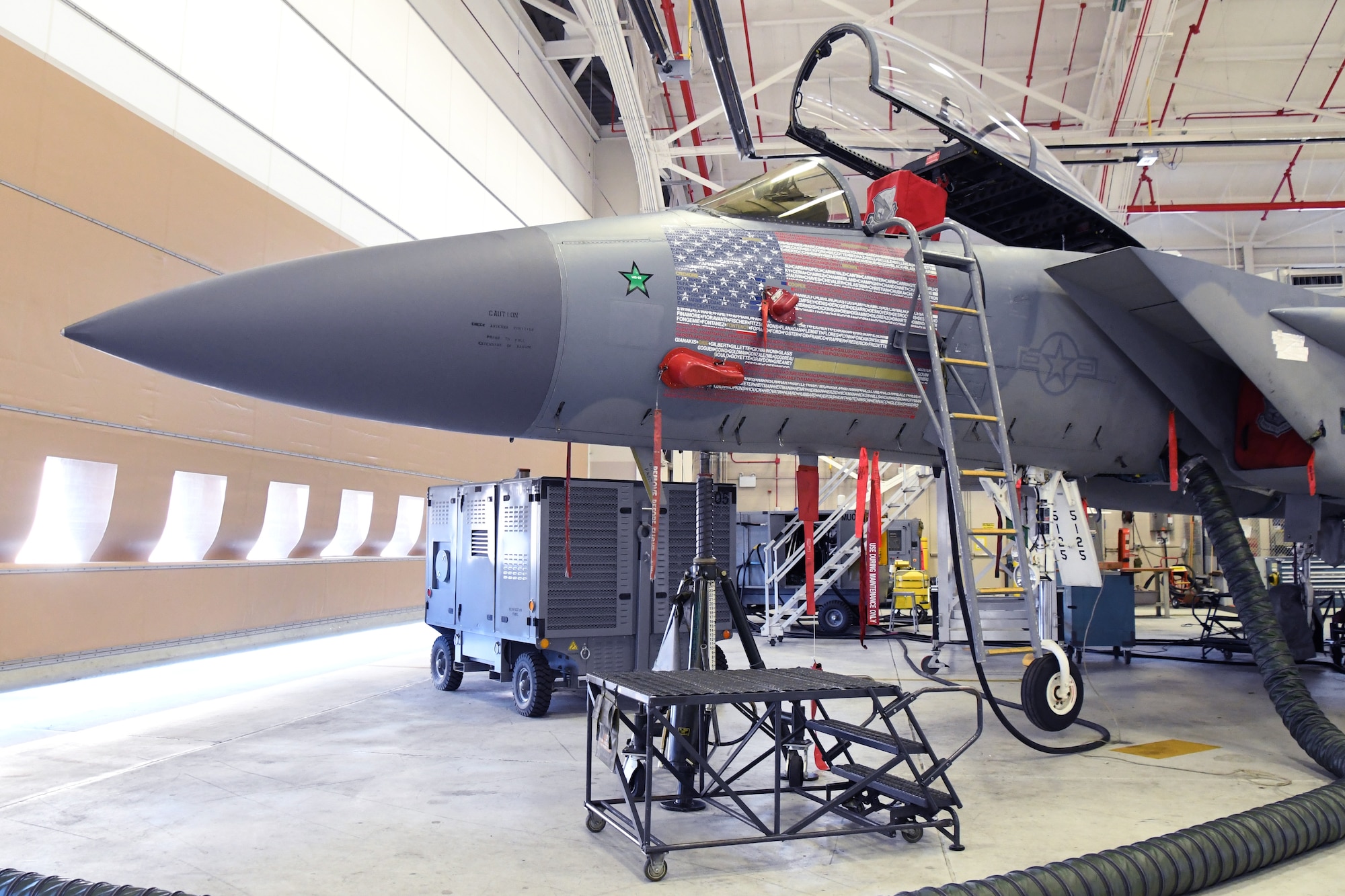 U.S. Air Force 104th Fighter Wing’s flagship F-15C Eagle sits in the base’s Main Hangar January 22, 2021, at Barnes Air National Guard Base, Mass. The F-15 received new decals that represent the American flag and every member in the wing. (U.S. Air National Guard photo by Staff Sgt. Hanna Smith)