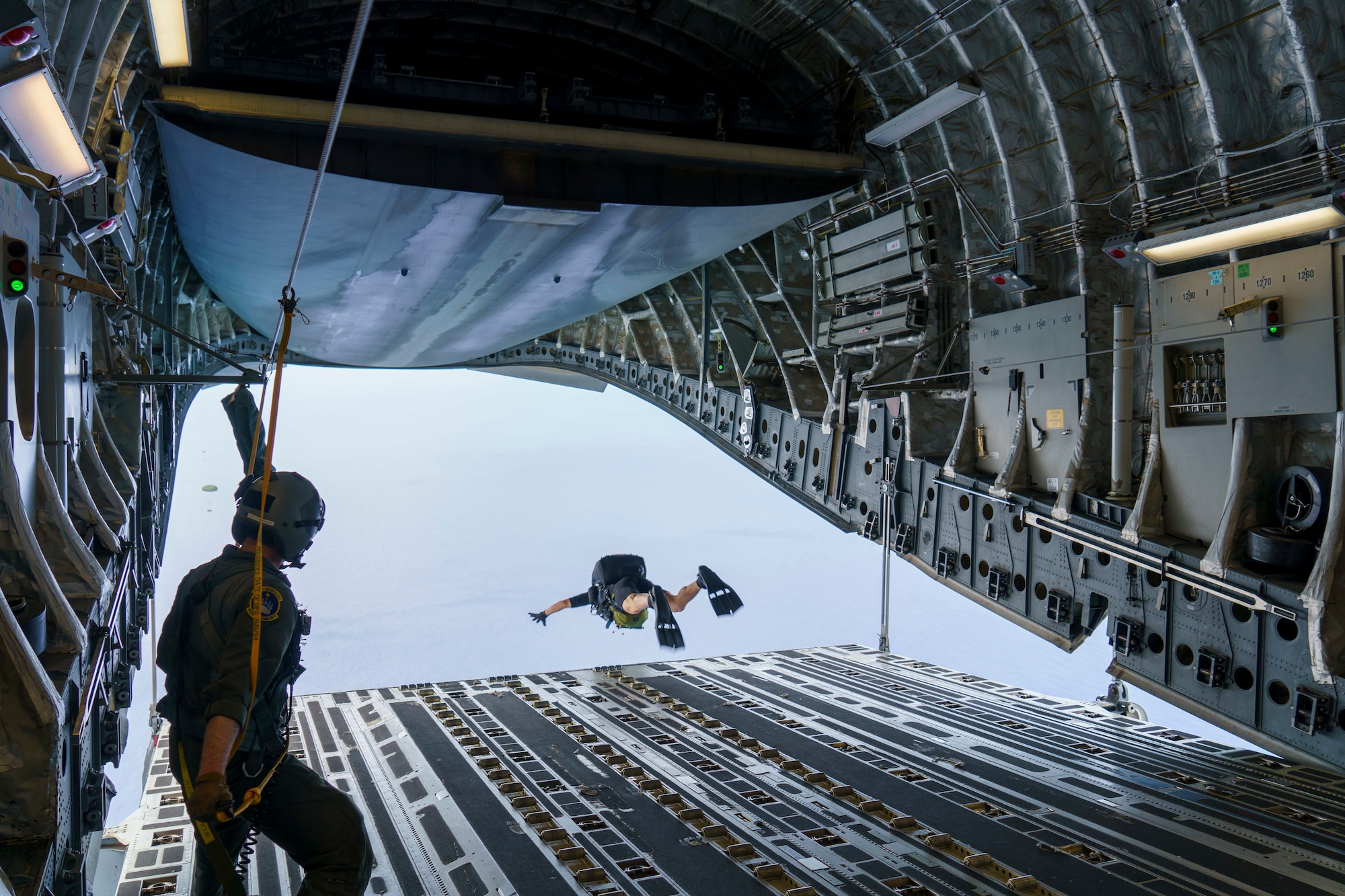 Maj. Brock Roden, a combat rescue officer with 212th Rescue Squadron, Alaska Air National Guard, conducts a freefall-parachute jump into the Pacific Ocean from a C-17 Globemaster III aircraft near Kapolei, Hawaii, Jan. 26, 2021, during Exercise H20. Alaska Air National Guardsmen were in Hawaii training during Exercise H20 in January and February, honing their long-range search and rescue capability in support of the NASA human spaceflight program .