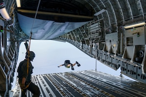 Maj. Brock Roden, a combat rescue officer with 212th Rescue Squadron, Alaska Air National Guard, conducts a freefall-parachute jump into the Pacific Ocean from a C-17 Globemaster III aircraft near Kapolei, Hawaii, Jan. 26, 2021, during Exercise H20. Alaska Air National Guardsmen were in Hawaii training during Exercise H20 in January and February, honing their long-range search and rescue capability in support of the NASA human spaceflight program .