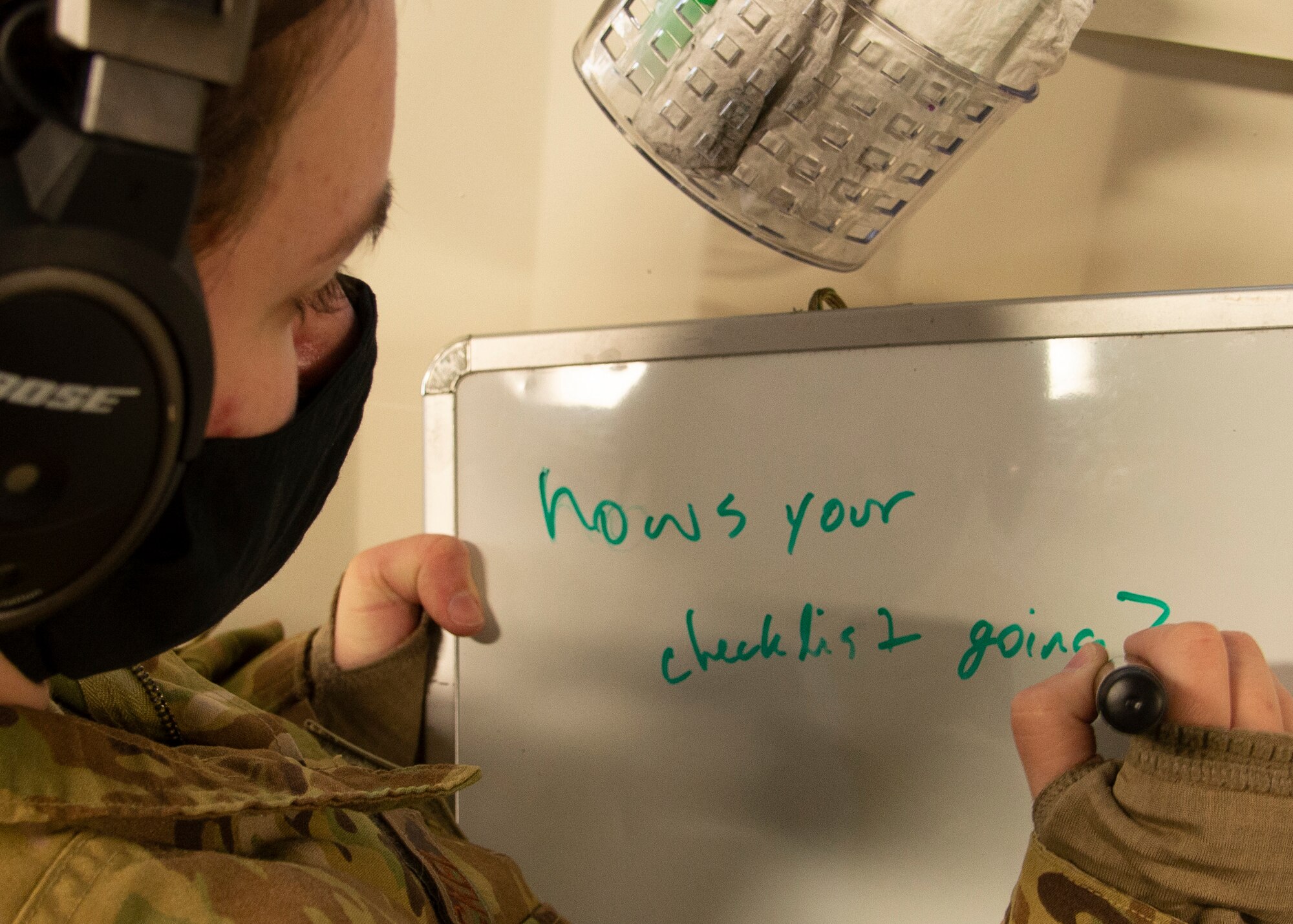 U.S. Air Force Staff Sgt. Rileigh Schickel, 10th Expeditionary Aeromedical Evacuation Flight aeromedical evacuation technician, writes a message on a whiteboard during a training at Ramstein Air Base, Germany, Jan. 26, 2021.