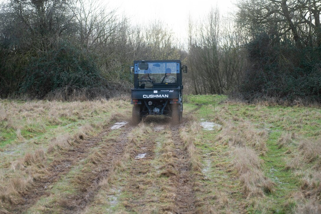 U.S. Air Force Col. Kurt Wendt, right, 501st Combat Support Wing commander, and Lt. Col. Joseph Knothe, left, 420th Air Base Squadron commander, drive an ATV around the base perimeter of Royal Air Force Fairford, England, Feb. 3, 2021. The 501st CSW command team visited the 420th Expeditionary Air Base Squadron team, deployed from Spangdahlem Air Base, to recognize their efforts in keeping the flight line running during inclement weather. (U.S. Air Force photo by Senior Airman Jennifer Zima)