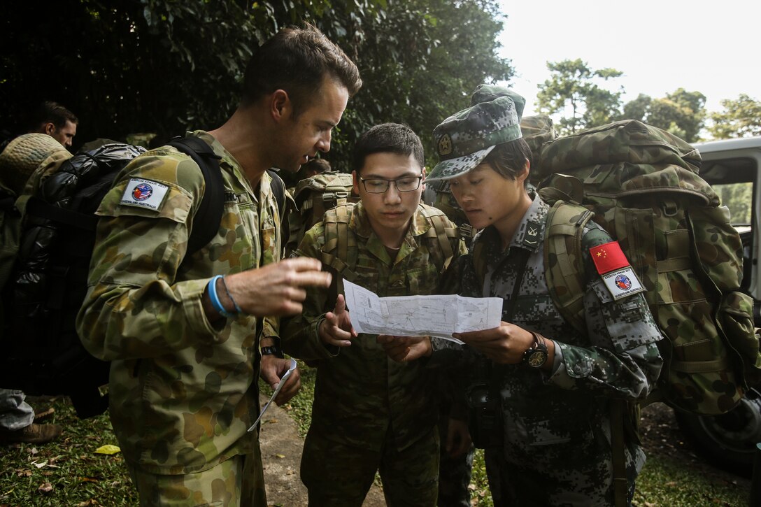 Chinese People’s Liberation Army receives route map with instructions before leading her team of fellow Chinese soldiers, U.S. Marines, and Australian soldiers to summit of Queensland’s highest peak during Exercise Kowari 2017