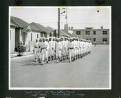 African-American Coast Guard recruits march at TRACEN Manhattan Beach during World War II