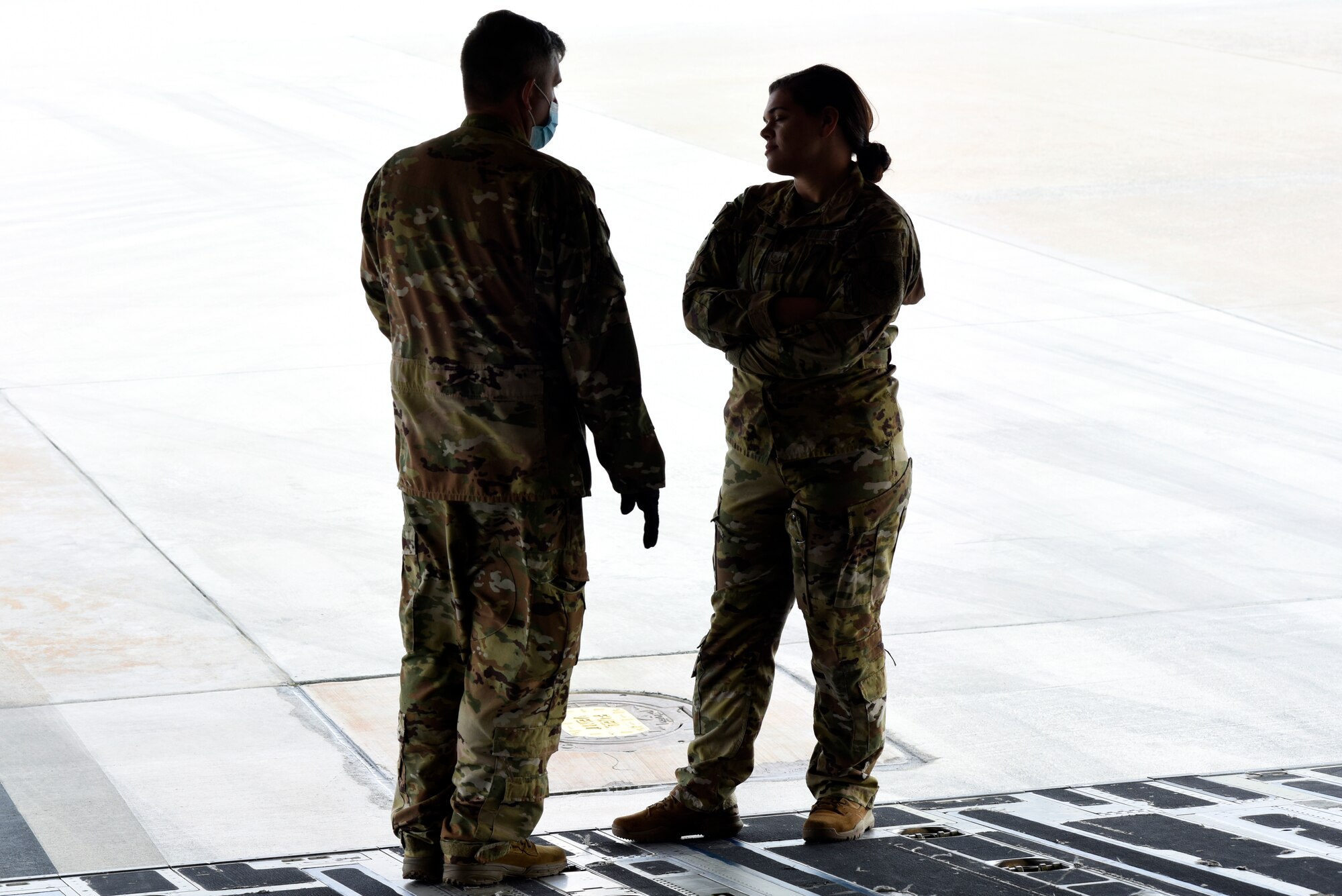U.S. Air Force Tech. Sgt. Shaun Gamble(middle left), 156th Airlift Squadron (AS) loadmaster, provides positive feedback to Airman 1st Class Shelby Rankin, 145th AS loadmaster on the ramp of a C-17 Globemaster III aircraft during a Cargo Deployment Function (CDF) exercise held at the North Carolina Air National Guard Base, Charlotte Douglas International Airport, Feb. 7, 2021. A CDF is similar to a personnel deployment line where you have a station to assemble items, check them for quality and to make sure they can safely be loaded onto an aircraft. Once the items are cleared to be loaded onto an aircraft, they reach the final phase of the CDF.