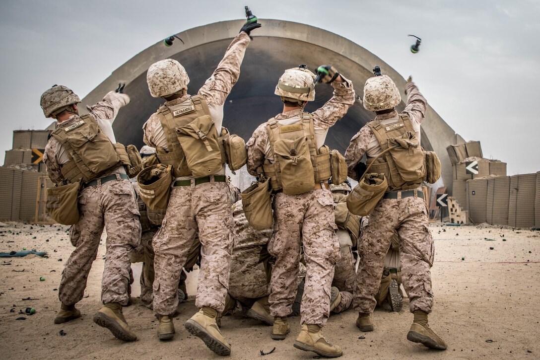 Marines throw nonlethal grenades during nonlethal weapons training exercise, January 18, 2020.