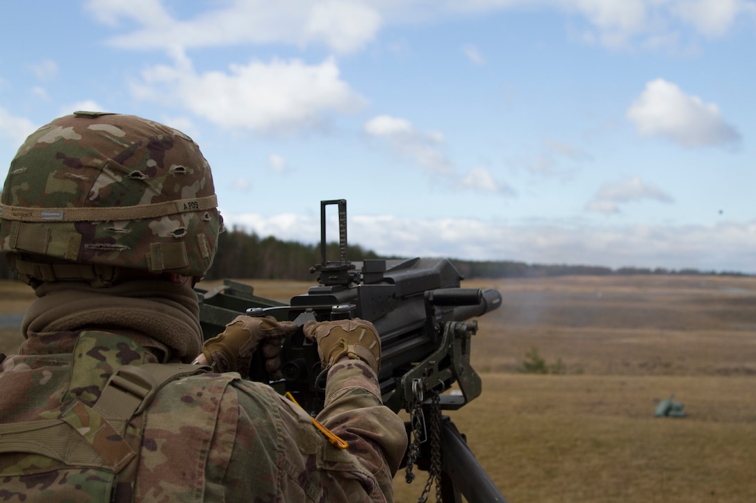 Soldier launches grenade down range with MK-19mm grenade machine gun