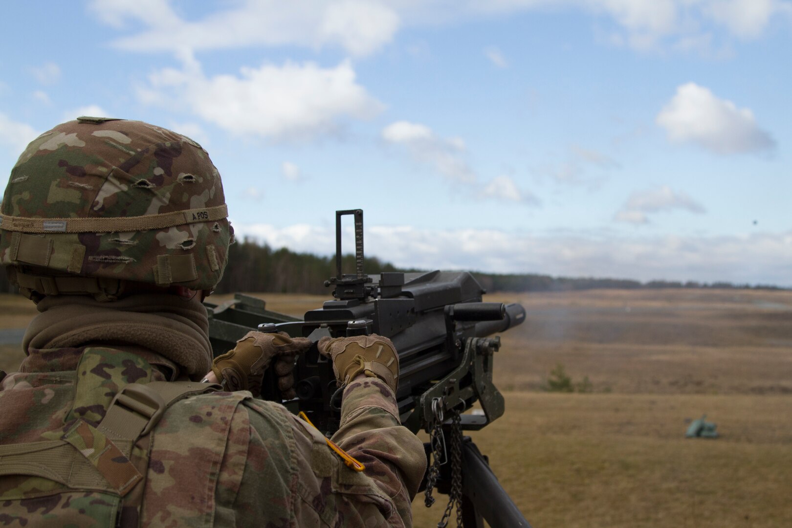 Soldier launches grenade down range with MK-19mm grenade machine gun