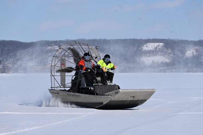Crew use airboat to conduct ice surveys