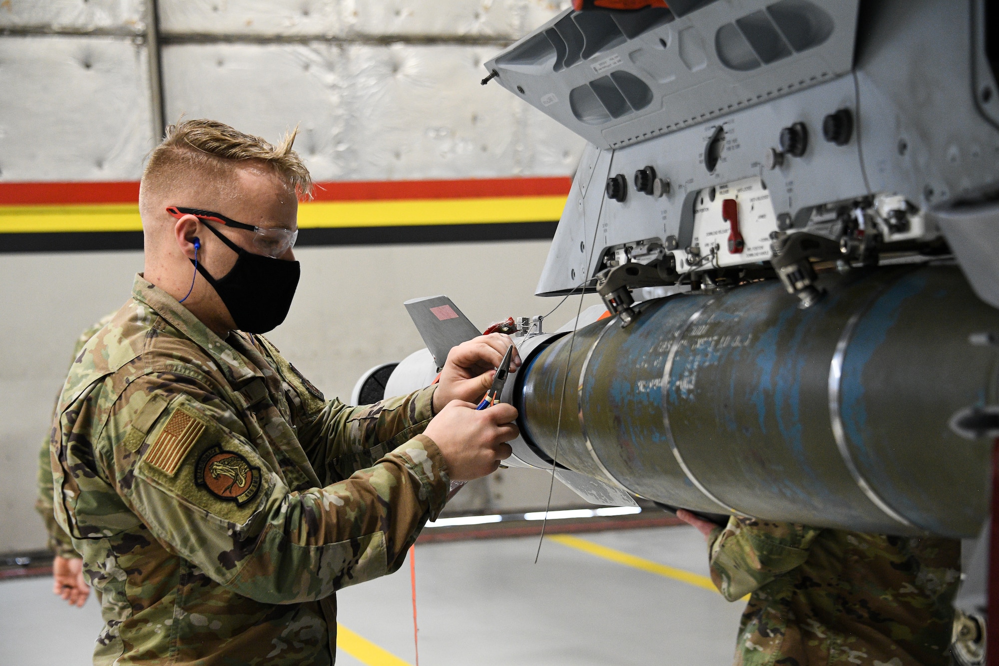 Senior Airman Seth Holden, 466th Aircraft Maintenance Unit, participates in an annual F-35 weapons load competition