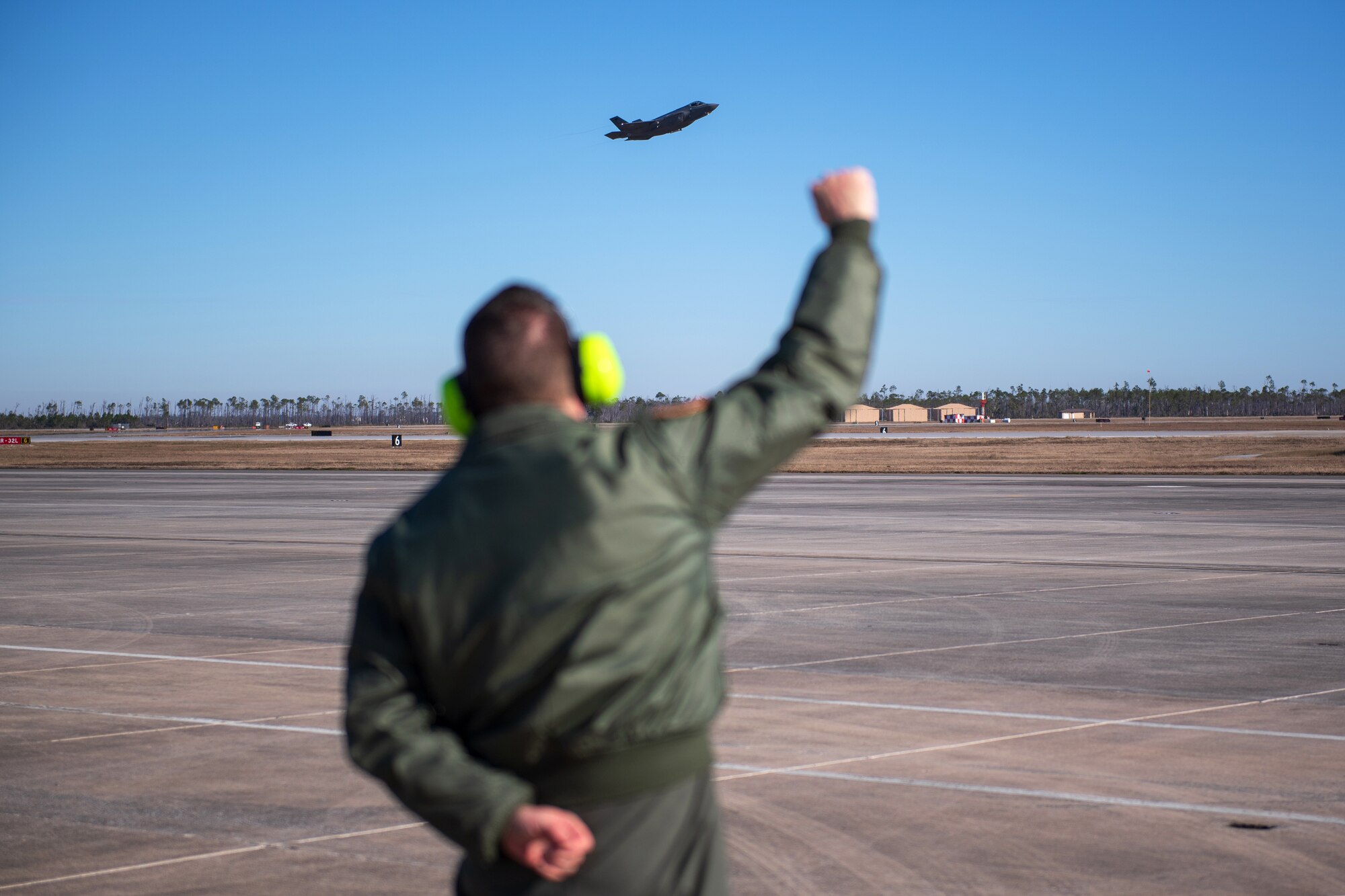 Brig. Gen. Henry Harder, assistant adjutant general - air, Vermont National Guard, watches an F-35 Lightning II take off from Tyndall Air Force Base