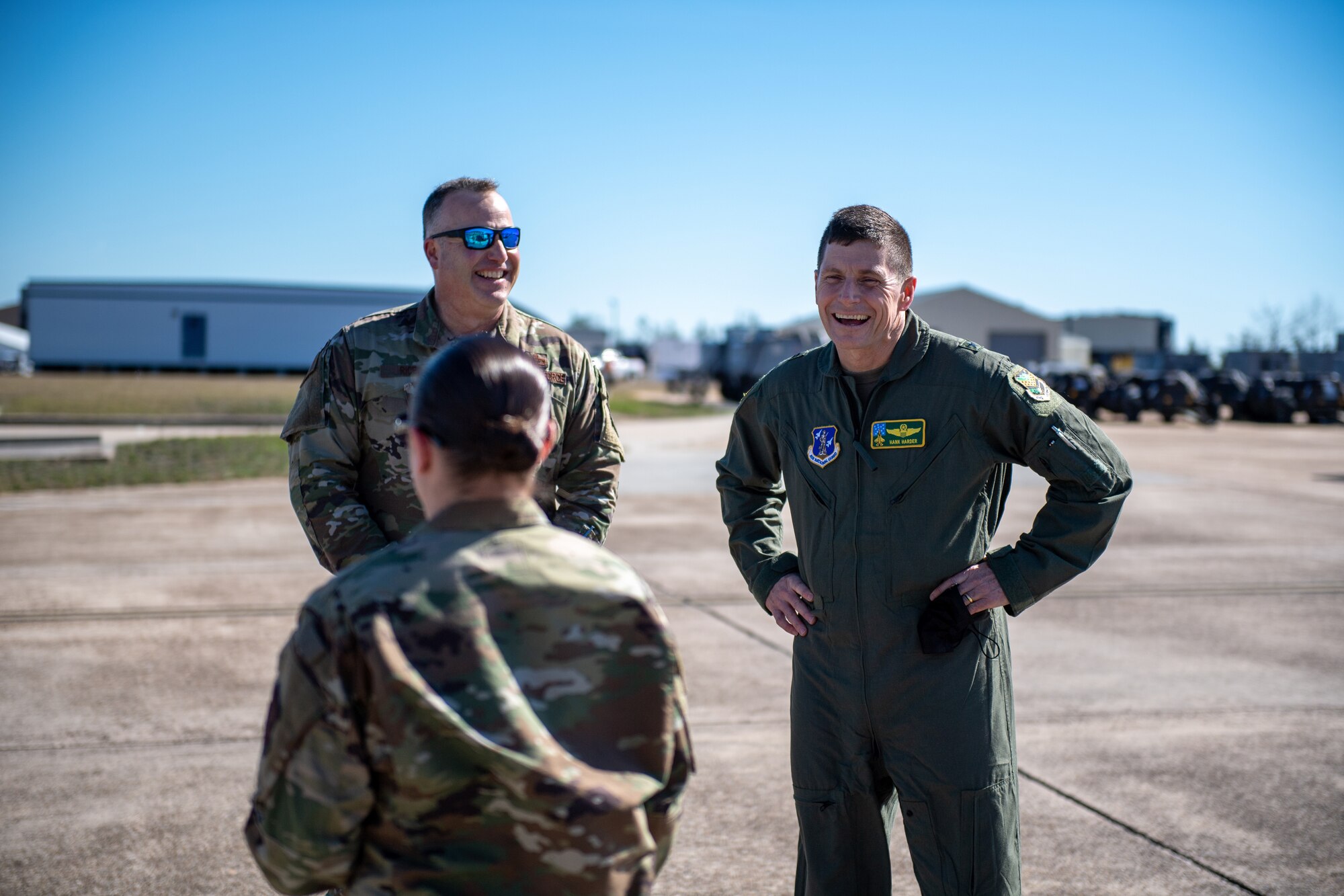 Brig. Gen. Henry Harder, assistant adjutant general - air, Vermont National Guard, and Col. Adam Rice, vice wing commander, 158th Fighter Wing, enjoy conversation with MSgt Victoria Cadieux.