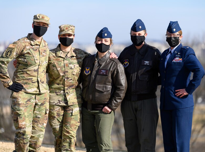 Maj. Megan Biles, Maj. Alea Nadeem, Lt. Col. Jessica Ruttenber, Lt. Col. Kathryn Gaetke and Lt. Col. Kimberly Smith pose for a photo during a photo shoot illustrating the Air Force's new hair policy for women. The members of the Women's Initiative TeamWIT were instrumental in bringing about the policy change.