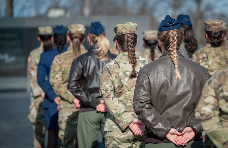 As an outcome of the 101st Air Force uniform board, Air Force women will be able to wear their hair in up to two braids or a single ponytail with bulk not exceeding the width of the head and length not extending below a horizontal line running between the top of each sleeve inseam at the under arm through the shoulder blades. In addition, women's bangs may now touch their eyebrows, but not cover their eyes. These new changes will be effective upon publication of the new standards in Air Force Instruction 36-2903, Feb. 10, 2021.