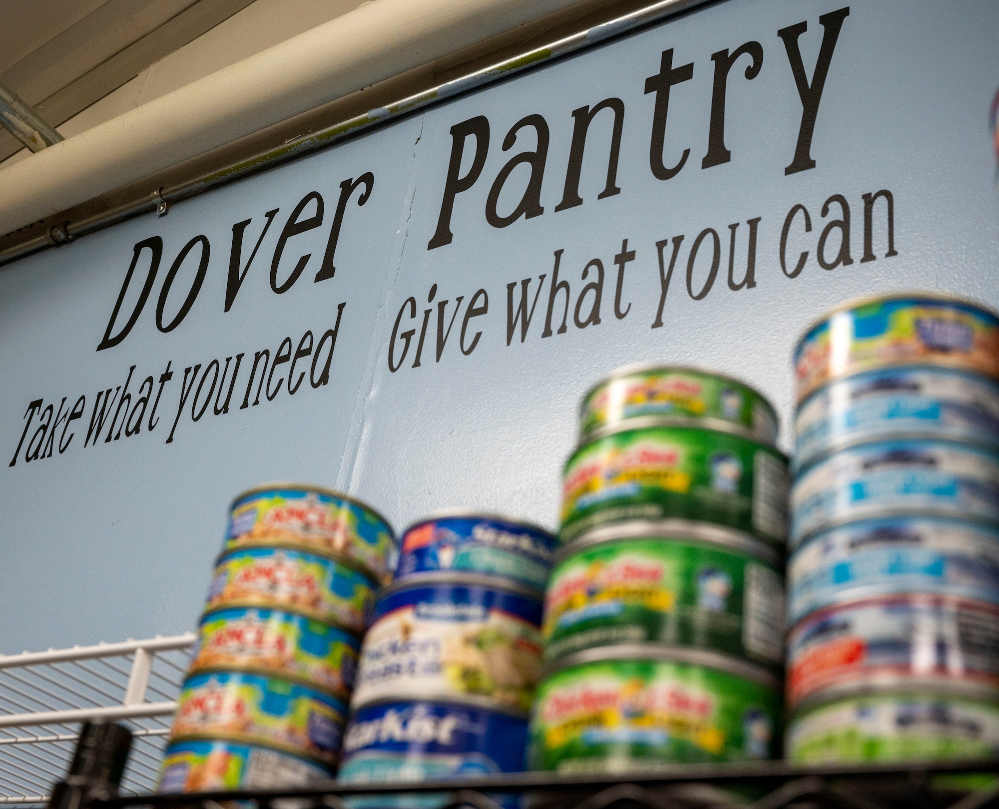 Created by key spouses, Lynne Otis and Jessica Hammer, the Dover Food Pantry encourages Airmen to “take what they need” and “give what they can” at Dover Air Force Base, Delaware, Jan. 20, 2021. Located in the Airman’s Attic, the food pantry was created by Otis and Hammer in an effort to alleviate financial burdens Airmen and their families may face during the COVID-19 pandemic. (U.S. Air Force photo by Airman 1st Class Cydney Lee)