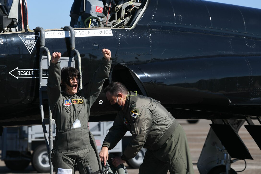 Brig. Gen. Patrice Melancon poses in front of an air craft