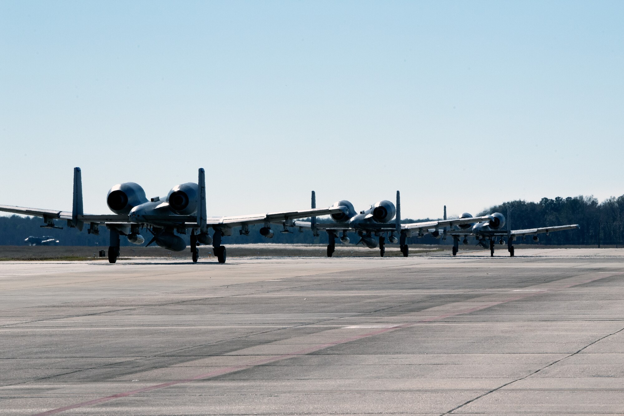A photo of three aircraft in a row.