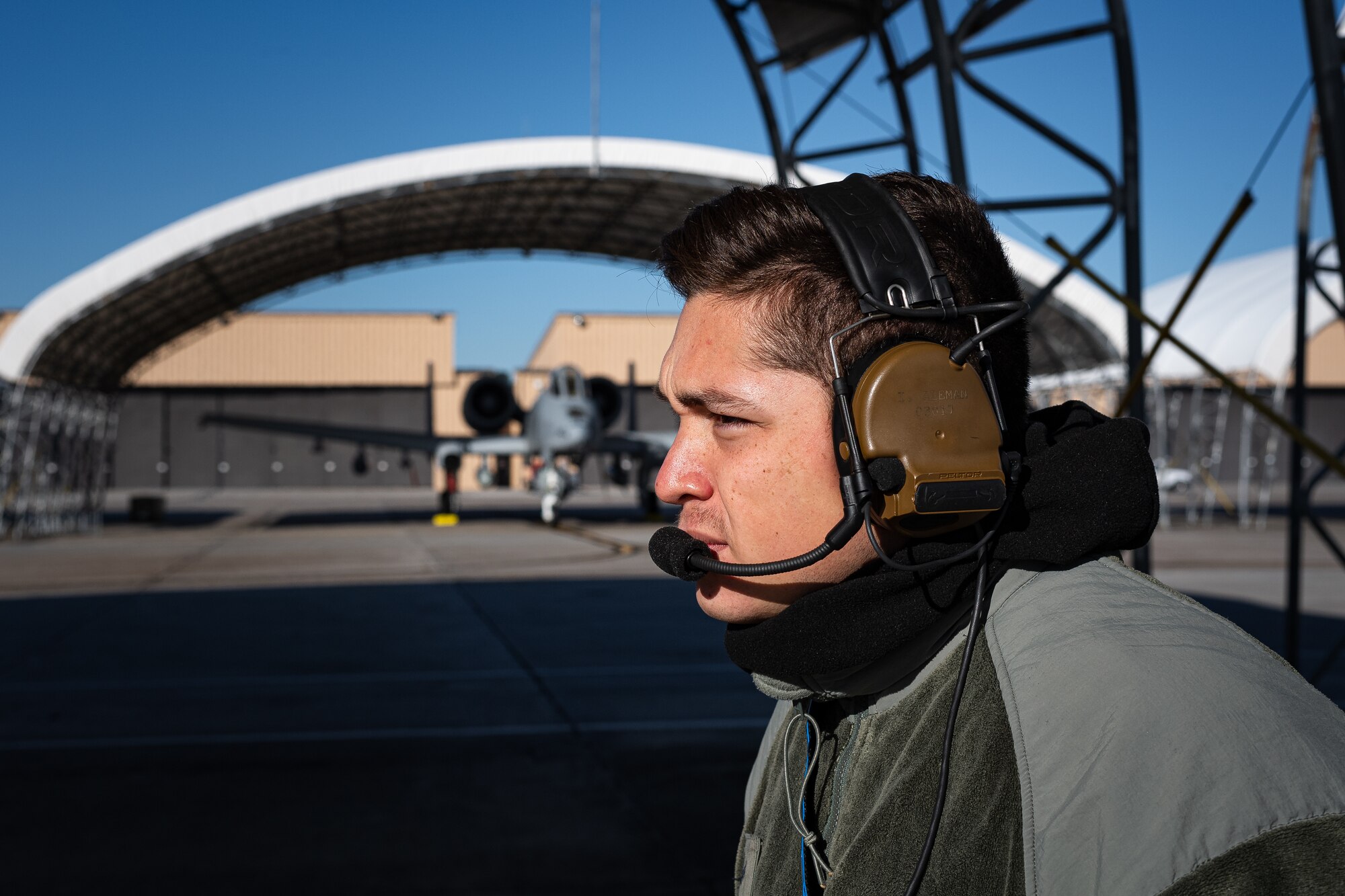 A photo of an Airman inspecting an aircraft
