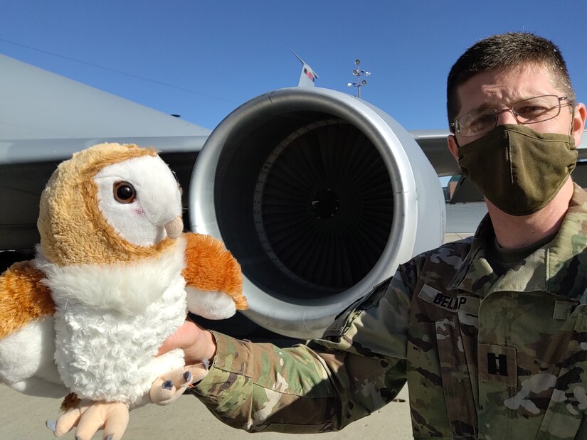 Capt. Jeffrey Dallin Belnap has been carrying Jupiter with him in his backpack. When the opportunity presents itself, he pulls out the stuffed animal and snaps a photo.