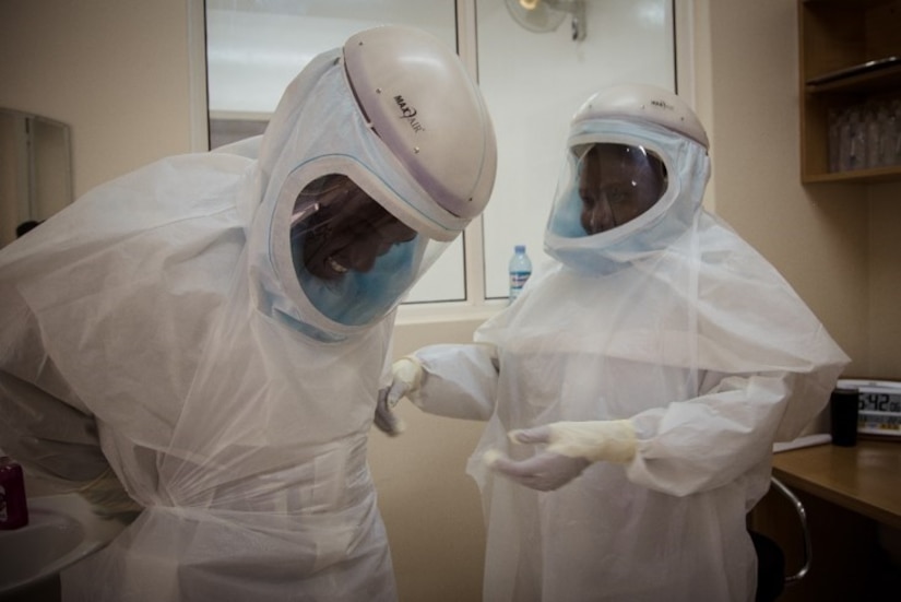 Two lab technicians dress in PPE