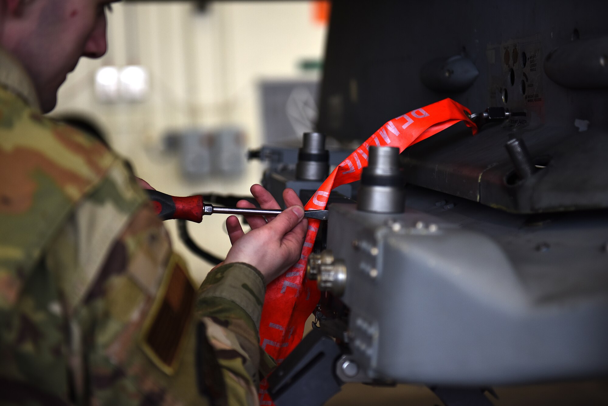 Senior Airman Merlin Reiland, 8th Maintenance Squadron load crew team member, prepares to load munition on an F-16 Fighting Falcon during the Annual Load Crew Competition at Kunsan Air Base, Republic of Korea, Feb. 6, 2021. Three teams completed in four categories to include dress and appearance, a weapons knowledge test, a toolbox inspection and a weapons load. (U.S. Air Force photo by Senior Airman Suzie Plotnikov)