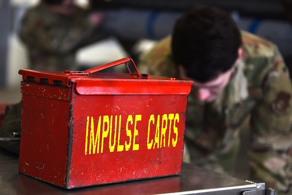 Senior Airman Merlin Reiland, 8th Maintenance Squadron load crew team member, looks through a toolbox during the Annual Load Crew Competition at Kunsan Air Base, Republic of Korea, Feb. 6, 2021. Three teams completed in four categories to include dress and appearance, a weapons knowledge test, a toolbox inspection and a weapons load. (U.S. Air Force photo by Senior Airman Suzie Plotnikov)