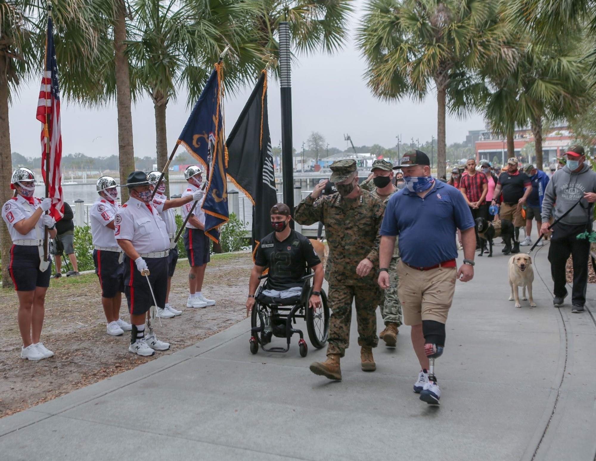 U.S. Marine Corps General Kenneth F. McKenzie Jr., the commander of U.S. Central Command, walking alongside veterans of multiple United States military branches, salutes the members of the AVAST Color Guard, composed of Tampa Bay veterans, during the ‘Salute-To-Service-Stroll’ Feb. 6, 2021, at the Tampa Riverwalk, Tampa, Florida. The event was organized by Sierra Delta, a nonprofit aimed at connecting veterans with service dog training. (U.S. Army photo by Spc. Robert Vicens)