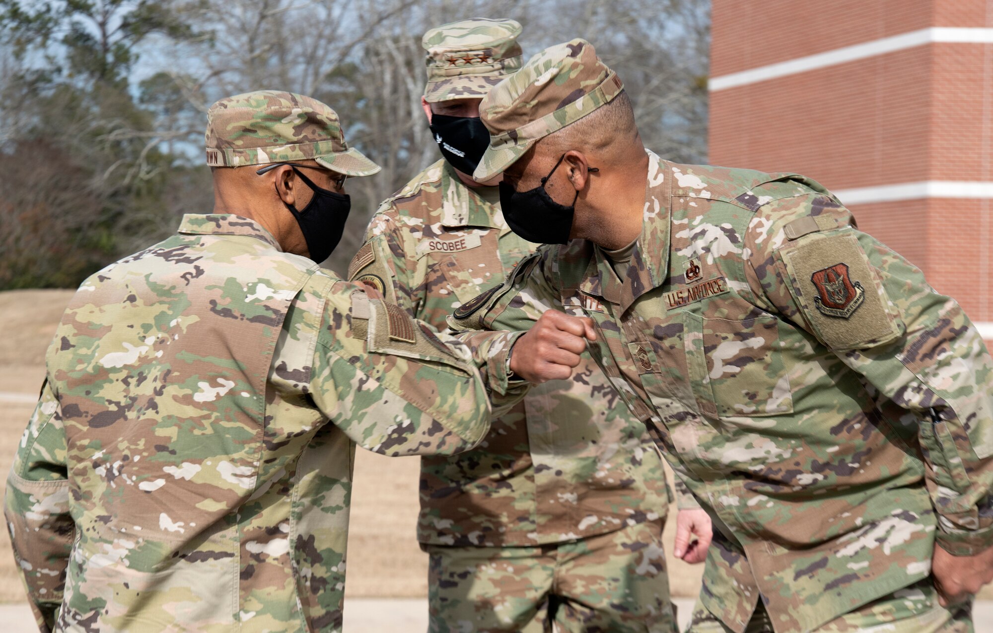 Air Force Chief of Staff, Gen. Charles Q. Brown Jr. (L), greets Air Force Reserve Command senior leaders Lt. Gen. Richard W. Scobee and Chief Master Sergeant Timothy C. White, upon his arrival to Air Force Reserve Command headquarters on Robins Air Force Base in Georgia on Feb. 8, 2021. While at the headquarters, Brown discussed COVID-19 response efforts, diversity and inclusion issues, readiness, and the role of the Air Force Reserve in the future fight. (U.S. Air Force photo by Master Sgt. Stephen D. Schester)