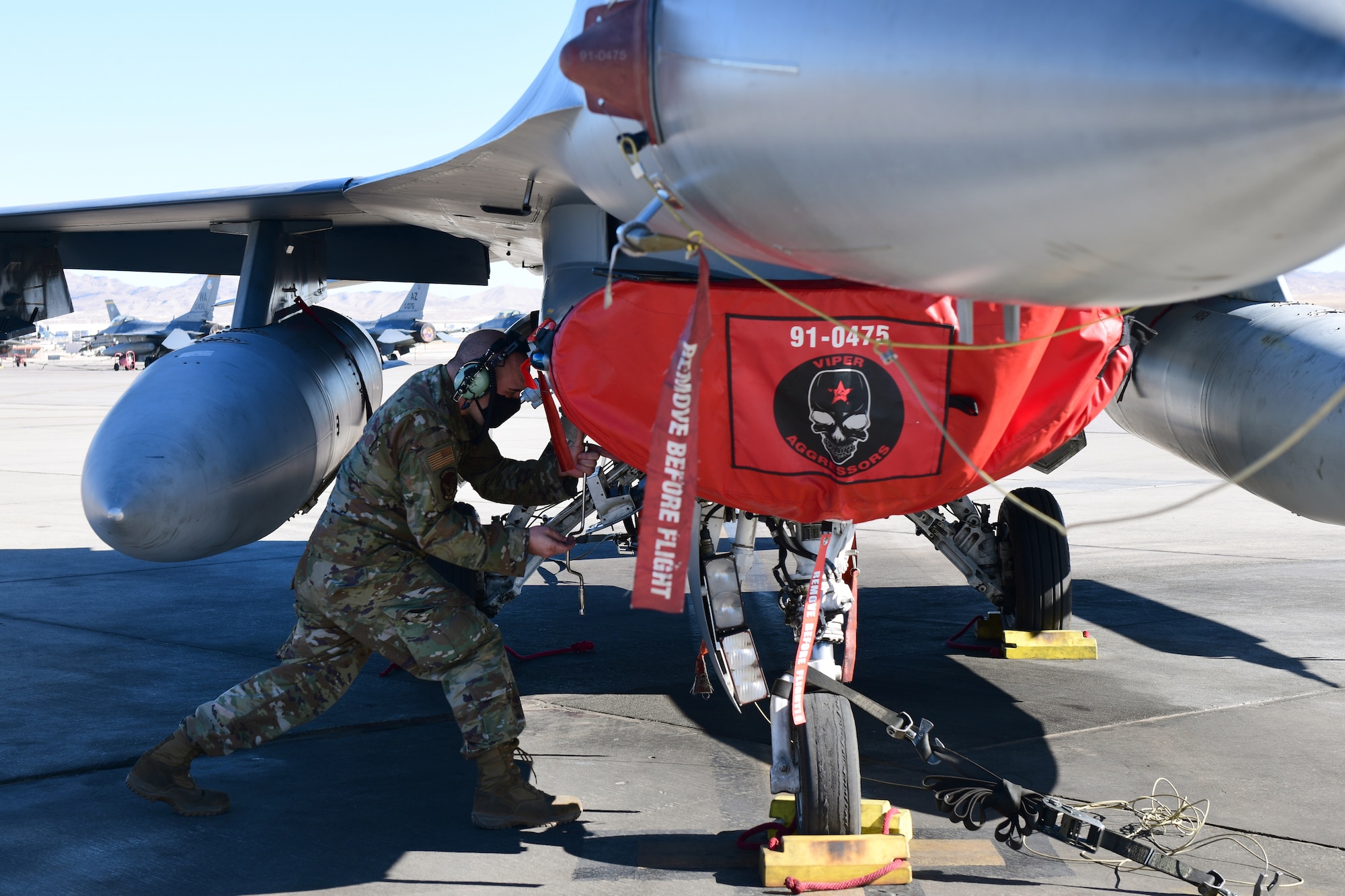 Staff Sgt. Scott Stump, 926th Aircraft Maintenance Squadron, works on an F-16, Feb. 6, at Nellis Air Force Base, Nevada.