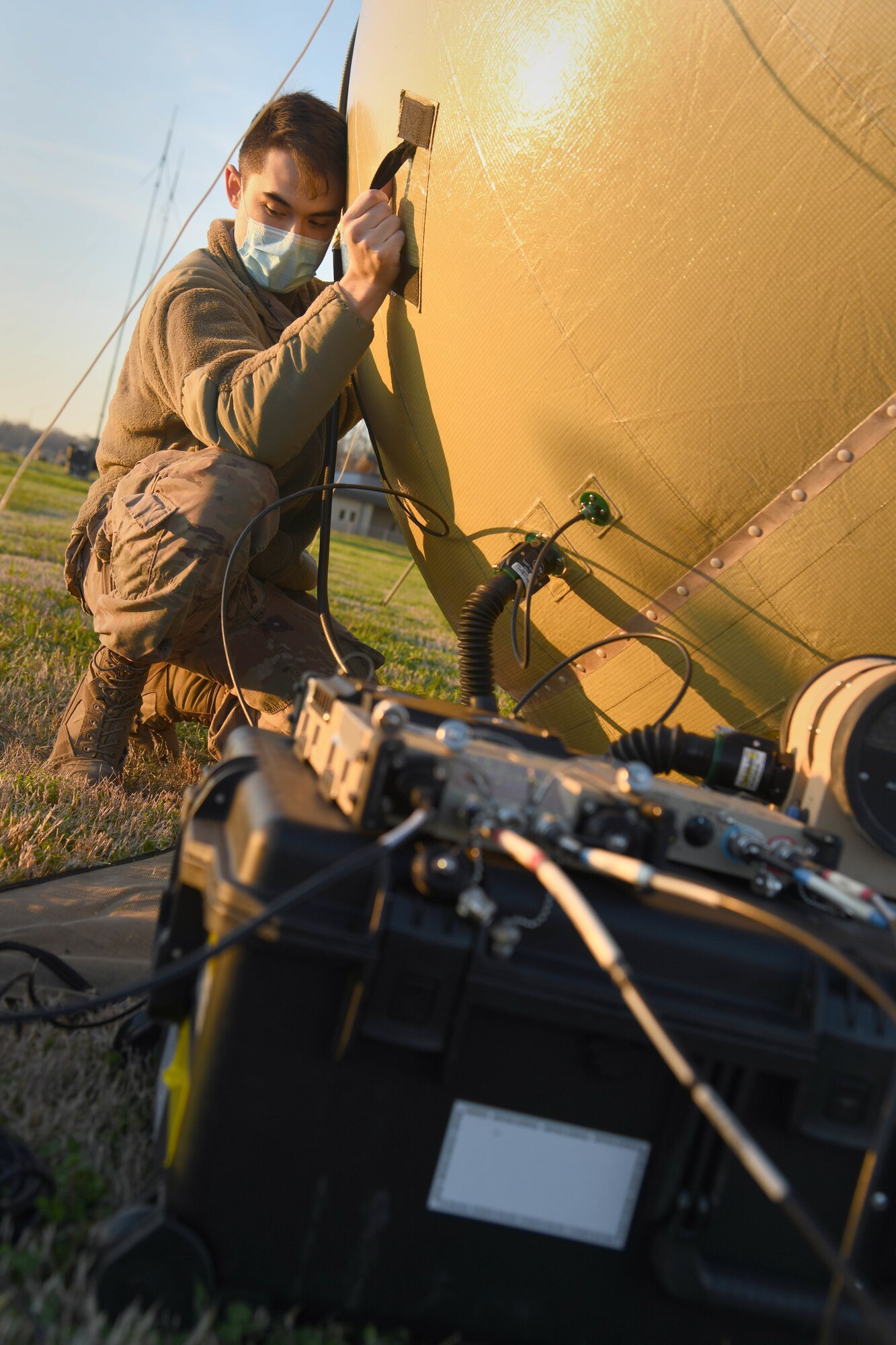 U.S. Air Force Staff Sgt. Frederick Van Riper, 621st Contingency Response Support Squadron mobile command, control, communications and computers supervisor, sets up the satellite dish for the small communications package Feb. 1, 2021, at the Alexandria International Airport, Louisiana. Airmen were able to employ new tent systems and a small communications package during a Joint Readiness Training Center exercise Jan. 31-Feb. 9 in Louisiana. (U.S. Air Force photo by Master Sgt. Melissa B. White)