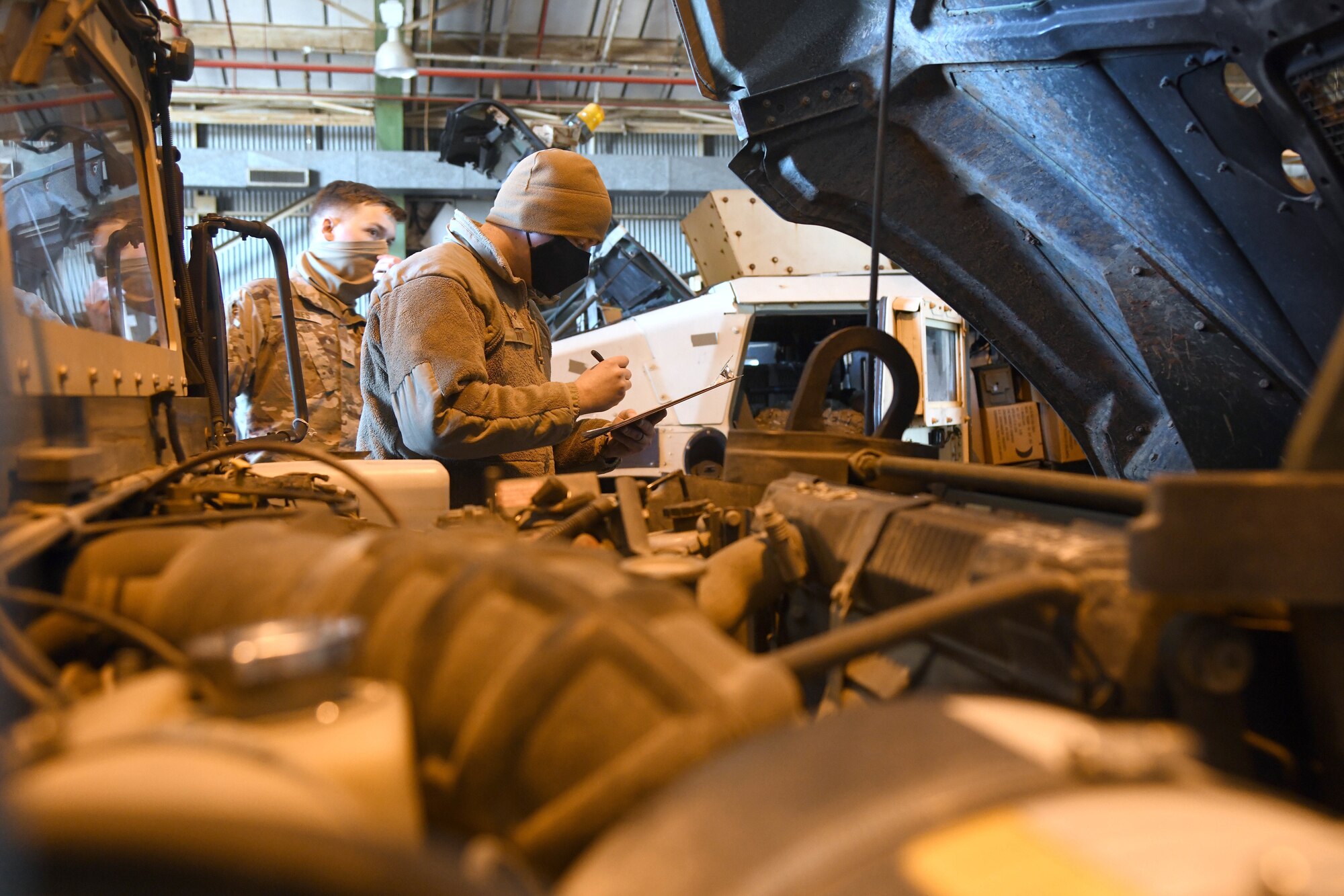 U.S. Air Force Senior Airman Scott Toy, 321st Contingency Response Squadron aerial port contingency response specialist, conducts a joint inspection for a Humvee Feb. 1, 2021, at the Alexandria International Airport, Louisiana, to ensure it is safe for aircraft transport. Airmen from the 621st Contingency Response Group participated in a Joint Readiness Training Center exercise Jan. 31-Feb. 9 at the airport and a nearby landing zone. (U.S. Air Force photo by Master Sgt. Melissa B. White)