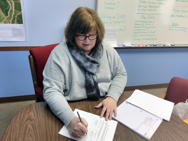 Hamburg Mayor Cathy Crain signs a Section 1176 project agreement Monday that will allow the U.S. Army Corps of Engineers to raise the Hamburg Ditch 6 levee eight feet, significantly increasing the flood risk management benefits the levee provides to the city.