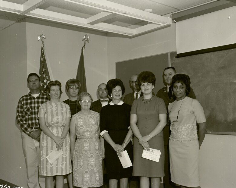 a group of people standing in two rows