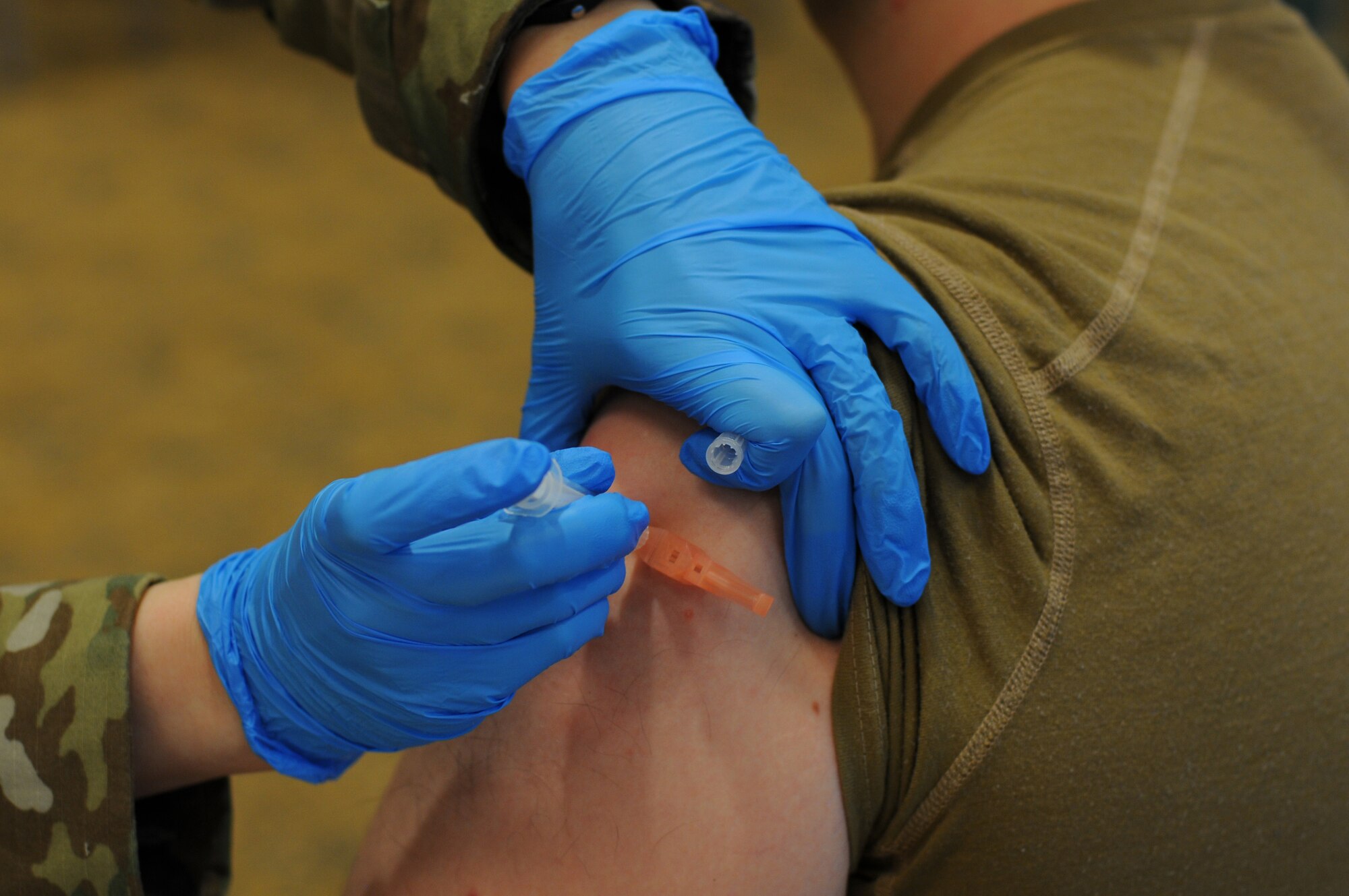 A Reserve Citizen Airman assigned to the 446th Airlift Wing receives the first dose of the Moderna COVID-19 vaccine at Joint Base Lewis-McChord, Washington, Feb. 6, 2021.